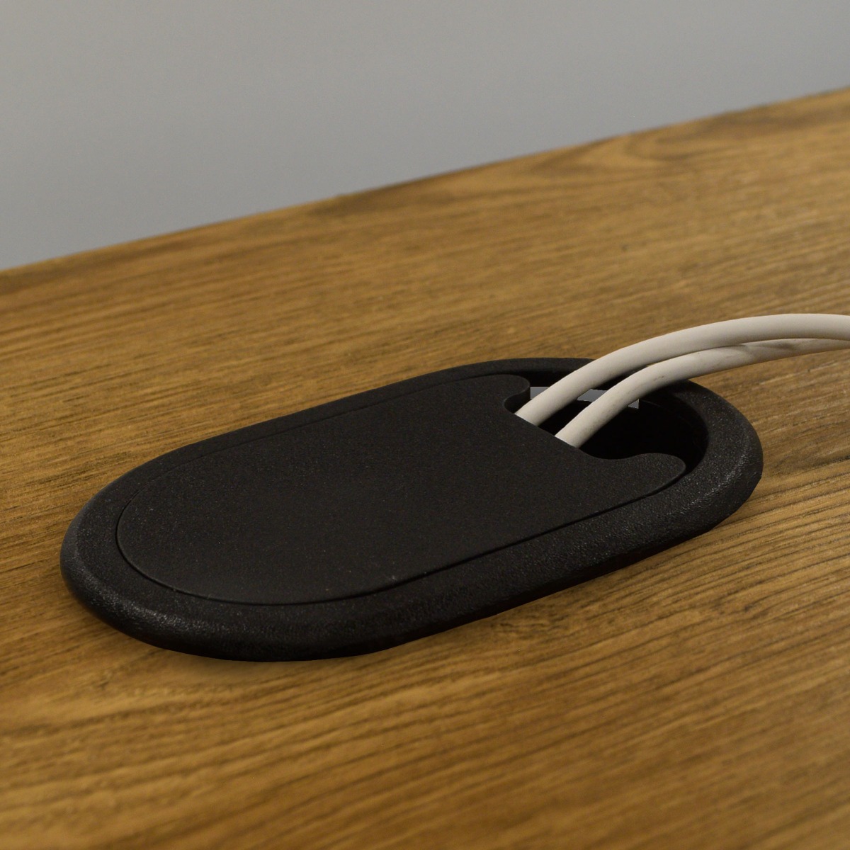 Pasacables ovalado para escritorio o mesa de 30 mm de altura, color negro